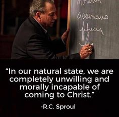 a man writing on a blackboard with a quote from r c sproul