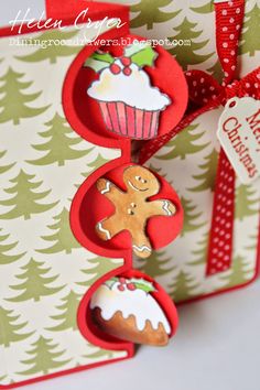 a close up of a christmas card with ginger cookies and cupcakes on it