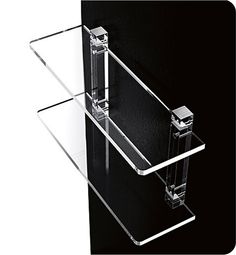 a clear glass shelf with two shelves on each side and one in the middle, against a black background