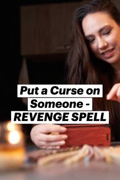 a woman sitting at a table looking at a cell phone with the caption put a curse on someone - revenge spell