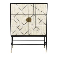 a black and white cabinet with an abstract design on the front, gold circles in the middle