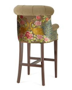 an upholstered bar stool with a floral design on the back and seat cushion