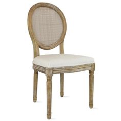 a wooden chair with a white upholstered back and seat cushion on the side