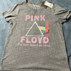 a pink floyd t - shirt with the dark side of the moon printed on it