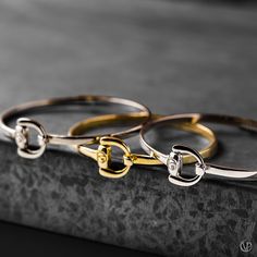 Equestrian Bangles with a horse bit design in Sterling Silver, Rose Gold, and Rhodium.  -Vincent Peach   #vincentpeach #marathonvillage #madeintn #madeinnashville #luxuryjewelry #designerjewelry #highfashionjewelry #bangle #bracelet #rosegold #sterlingsilver #rhodium #equestrianjewelry #equestrianluxury #equestrianbracelet #affordableluxury #rosegoldbracelet #rhodiumbracelet #sterlingsilverbracelet #gift #giftidea #giftguide #giftbracelet  #jewelrylover Luxury Gold Sterling Silver Bangle, Equestrian Bracelet Jamies Horse Jewelry, Luxury Sterling Silver Bangle Bracelets, Luxury Elegant Jewelry With Horse Design, Equestrian Jewelry Ashley's Equestrian Jewelry, Luxury Artisan Bracelets As Gift, Luxury Unique Leather Jewelry, Luxury One-of-a-kind Bangle Jewelry, Luxury Sterling Silver Bangle As Gift