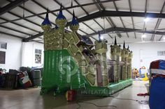 an inflatable castle is set up inside a warehouse