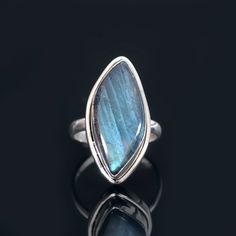 Labradorite Ring Metal- Sterling Silver Stone Cut- Oval Ring Size- 8 US Weight- 7.28 Gm ABOUT LABRADORITE- Wearing or carrying Labradorite allows one's natural magical abilities to manifest. It improves mental and intuitive talents such as clairvoyance, telepathy, prophesy, and coincidence control, and it aids in communication with higher guides and spirits in Akashic records, psychic readings, and past-life recollection. It facilitates travel between worlds and allows for a safe and grounded return to the present. Adjustable Labradorite Open Ring, Untreated Labradorite For Jewelry Making, Adjustable Labradorite Cabochon Ring, Adjustable Cabochon Labradorite Ring, Labradorite Jewelry With Bezel Setting As Gift, Labradorite Jewelry With Bezel Setting For Gift, Turquoise Moonstone Ring With Natural Stones As Gift, Bohemian Jewelry With Bezel Setting As Gift, Bohemian Jewelry With Bezel Setting For Gift