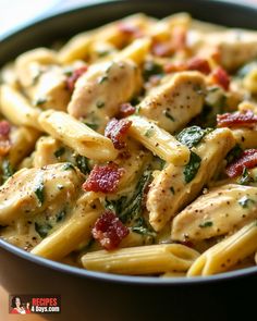 a pasta dish with chicken, spinach and sun dried tomatoes