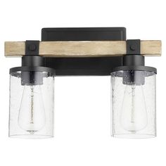 two light bathroom fixture with clear glass shades and wood trimmings on the sides