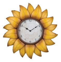 a sunflower clock is hanging on the wall