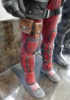 the legs and leg pads of deadpool cosplays are seen in this image