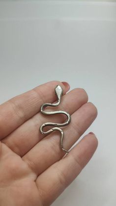 Vintage 925 silver snake pendant, has multiple hallmarks In great condition,with time patina Weight 4g Size 47x23mm All of our pieces are in pre-loved, vintage or antique condition, with signs of age and wear preserved as a mark of authenticity. Vintage Silver Snake Jewelry, Silver Snake-shaped Oxidized Jewelry, Silver Oxidized Snake-shaped Jewelry, Oxidized Silver Snake Jewelry, Serpent Necklace, Lover Necklace, Snake Lovers, Lovers Necklace, Snake Pendant