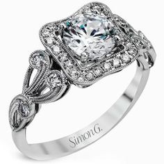 a white gold engagement ring with an intricate design on the shan shan shan shan shan shan shan