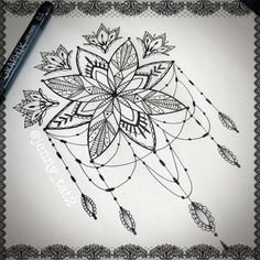 a drawing of a flower with arrows and feathers on the paper next to a marker pen