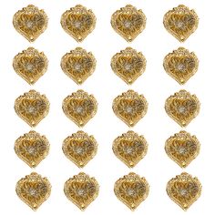 twelve gold heart shaped brooches with filigreets on each one side