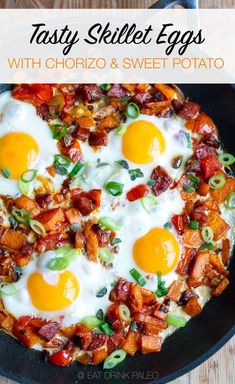 a skillet with eggs and bacon in it on top of a wooden table next to a