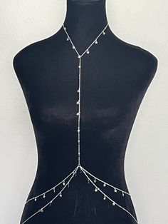 Make a statement with our Multilayer Star Tassel Chest Body Chain! This stunning body chain features a unique design with multiple layers and sparkling star charms that catch the light beautifully. Made with high-quality materials, this body chain is both durable and comfortable to wear. Add some glamour and style to your outfit with this statement piece.