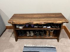 a wooden bench with several pairs of shoes on it