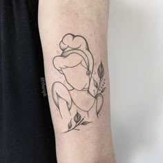 a woman's arm with a tattoo on it