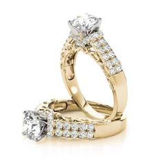 two gold wedding rings with diamonds on each one and an engagement ring in the middle