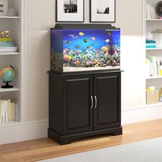 a fish tank sitting on top of a cabinet