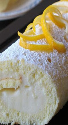 a piece of cake with orange slices and powdered sugar