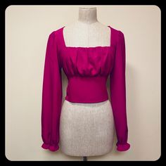 This Beautiful Magenta Blouse Has A Square Neckline And Peasant Sleeves That Are Cinched At The Wrists. It Is Shirred In The Back For A Perfect Fit. It Measures 17” From Armpit To Armpit And 17” From The Top Of The Shoulder To The Bottom Hem. 94% Polyester, 4% Spandex. Fitted Padded Blouse For Date Night, Fitted Crop Top Blouse For Date Night, Fitted Square Neck Blouse For Night Out, Trendy Fitted Blouse For Date Night, Fitted Square Neck Solid Color Blouse, Fitted Solid Square Neck Blouse, Fitted Square Neck Blouse In Solid Color, Fitted Solid Color Square Neck Blouse, Chic Cropped Blouse From Forever 21