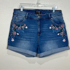 These Nwt Shorts Have A Floral Embroidery On The Front, Rolled Hem, And 5 Pockets. The Waistband Has Stretch So It Will Conform To Your Waist As You Move. They Are A Size 16, Which Should Fit Like A 1x According To The Size Guide But Please Be Sure To Double Check The Measurements In The Pictures To Ensure A Perfect Fit. Approximate Flat Waist: 17” Outseam: 15” Inseam: 4” Embroidered Denim Blue Jean Shorts, High Waist Blue Jeans With Floral Embroidery, Embroidered Medium Wash Denim Jean Shorts, High-waist Blue Jeans With Floral Embroidery, Cotton Jean Shorts With Floral Embroidery In Medium Wash, Embroidered Denim Blue Shorts, Medium Wash Cotton Jean Shorts With Floral Embroidery, Embroidered Denim Jean Shorts In Blue, Spring Embroidered Denim Blue Jean Shorts