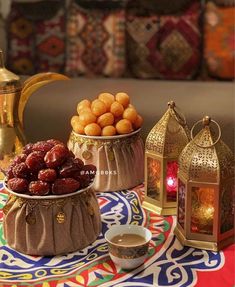 there are some food on the table and two teapots next to each other