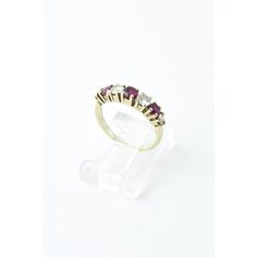 Classic seven stone ring featuring four diamonds with a total approximate weight of 0.40 carats and three rubies with an approximate weight of 0.30 carats, prong set in an 18k white gold mounting. US Size: 5. Sizable.  Dimensions reference the ring size and are not specific to the ring itself. Classic Three-stone Ruby Ring, Classic Three Stone Ruby Ring, Classic Three Stone Ruby Ring With Diamonds, Classic Red Three Stone Diamond Ring, Classic Ruby Diamond Multi-stone Ring, Classic Three Stone Round Ruby Ring, Classic Three Stone Ruby Promise Ring, Classic Half Eternity Ruby Ring, Classic Three Stone Ruby Ring For Anniversary