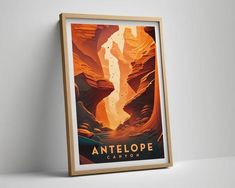 an art deco poster hangs on the wall in front of a white wall with a wooden frame