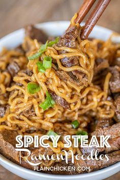 spicy steak ramen noodles in a white bowl with chopsticks sticking out of it