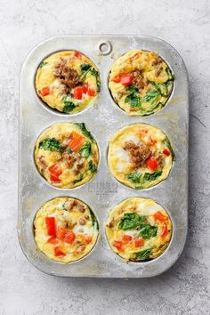 six muffin tins filled with different types of breakfast foods on top of a table