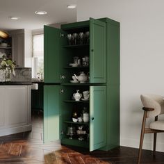 a green cabinet in the middle of a kitchen