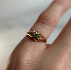 Such a beautiful piece! Solitaire emerald stone yellow gold ring. Preloved item Ring Size (approx.): 2.75 US Stamped 10KT gold Weight: 1.322g **FREE shipping within Canada and USA** If you have any questions or concerns, please do not hesitate to contact us. We will be more than happy to help you and answer any inquiries.  We invite you to check out our shop for more fabulous items! Hallmarked Emerald Diamond Ring For May Birthstone, Gold Emerald Jewelry With Round Band, Gold Emerald Ring With Prong Setting In Heirloom Style, Gold Emerald Ring For May Birthstone, Oval Shape, Emerald Ring Stamped 14k As Gift, 14k Stamped Emerald Ring As Gift, Gold Hallmarked Ring For May Birthstone, Gift Emerald Ring With 14k Stamp And Round Band, Gold Signet Ring With May Birthstone