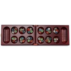 a wooden box with six compartments filled with different types of glass buttons on the inside