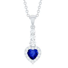 Product Details This stunning drop pendant features a brilliant heart shape blue sapphire gemstone surrounded with a Diamond halo, elegantly suspended from a delicate Diamond-studded bail. The vibrant hue of the sapphire contrasts beautifully with the sparkling Diamond stones, creating a piece that exudes sophistication and charm. Perfect for any occasion, this blue sapphire heart pendant is sure to become a cherished addition to any jewelry collection. Product Information SKU SHP-PENDANT0822101 Blue Sapphire Gemstone, Sparkling Diamond, Signature Jewelry, Timeless Jewelry, Sapphire Gemstone, Diamond Halo, Drop Pendant, Sparkle Diamonds, Conflict Free Diamonds