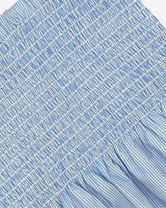 This pre-smocked, pre-shirred fabric is perfect for adult and girls dresses. The blue gingham check with dobby stripe in premium cotton is both stylish and comfortable. The elastic shirring provides a snug fit, while the fabric and strap sold separately provide endless possibilities for customization. With this product, you'll be able to create the perfect dress for any occasion. DETAILS• Contents: 100% Cotton Twill Gingham Check with Textured Dobby Stripe• Fabric Repeat: 1/16" Check with 1/8" R Cotton Gingham Smocked Dress With Ruffles, Cotton Smocked Dress With Ruffles In Gingham, Plaid Cotton Smocked Dress, Gingham Cotton Smocked Top With Ruffles, Gingham Smocked Cotton Top With Ruffles, Gingham Cotton Smocked Dress, Plaid Cotton Smocked Dress With Smocked Bodice, Elastic Shirring, Shirred Fabric