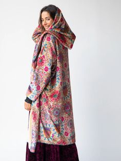 It’s a blanket and kimono in one! Traditional Oversized Winter Outerwear, Multicolor Oversized Shawl Outerwear, Multicolor Long Kimono For Winter, Winter Long Sleeve Kimono For Loungewear, Multicolor Winter Outerwear With Kimono Sleeves, Winter Multicolor Outerwear With Kimono Sleeves, One Size Kimono For Fall Loungewear, One Size Winter Kimono With Kimono Sleeves, Multicolor Kimono For Loungewear In Fall