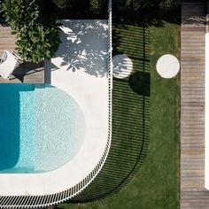 an aerial view of a swimming pool and deck