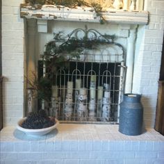 a fireplace with a potted plant next to it