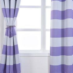 purple and white striped curtains in front of a window