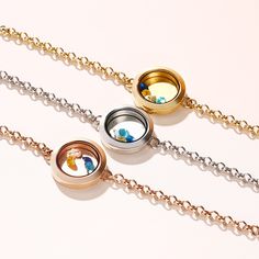 If you're looking for the perfect personalized gift, this customized floating locket is sure to please. Start by engraving on heart charm and disc inside, along with up to six colored stones to represent birthday or some of life's most meaningful milestones, made with gorgeous three tones plating over stainless steel,this engraved floating locket is a special gift for any special occasion. Jewelry makes a great gift - surprise your loved ones with this bracelet any time of the year.Carat Weight: Personalized Round Stainless Steel Jewelry, Nickel-free Stainless Steel Jewelry For Keepsake, Adjustable Stainless Steel Keepsake Jewelry, Personalized Stainless Steel Medallion Jewelry, Personalized Adjustable Round Locket Necklace, Round Birthstone Jewelry In Stainless Steel, Stainless Steel Round Birthstone Jewelry, Stainless Steel Round Pendant Jewelry For Best Friend, Stainless Steel Round Pendant Locket Jewelry