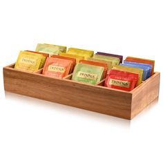 a wooden box filled with lots of different types of teas on top of each other