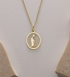 Gold Penguin life Pendant - Penguin Gold Necklace ● Material of pendant: Solid Gold 14k ( REAL GOLD ) ● Metal Stamp: 14k ( REAL GOLD ) ● The pendant is available in 5 sizes: - 12x17 mm / 0,47 x 0,66 inches - 13x18 mm / 0,51 x 0,70 inches  In the photos - 14x19 mm / 0,55 x 0,74 inches  - 16x21 mm / 0,62 x 0,82 inches  - 18x24 mm / 0,70 x 0,94 inches ( In the photos the size is 13x18 mm / 0,51 x 0,70 inches ) ( Jump Ring inner diameter: 4 mm ) ● Material of chain: Solid gold 14k ( REAL GOLD ) It is thin and dainty and it is available in 4 sizes: - 40 cm / 15,75 inches ( Length ) - 45 cm / 17,72 inches ( Length ) In the photos - 50 cm / 19,68 inches ( Length ) - 55 cm / 21,65 inches ( Length ) ● Backside engraving is FREE ( Please use the personalization box for that.) ● If you want larger si 14k Gold Oval Pendant Charm Necklace For Gift, Yellow Gold Oval Charm Necklace As Gift, Yellow Gold Oval Charm Necklace Gift, Yellow Gold Jewelry With Hallmark For Birthday, Silver Charm Necklace Stamped 14k As Gift, Gift Silver Charm Necklace Stamped 14k, Yellow Gold Charm Necklace As A Gift, Hallmarked Round Pendant Jewelry For Birthday, Nickel-free Gold Jewelry For Birthday Gift