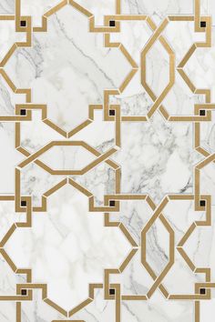 a marble tile with gold and black geometric designs