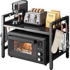 a toaster oven sitting on top of a counter with bread and coffee in it