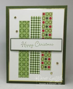 a handmade christmas card with green and red designs on the front, white background