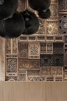 an intricately designed wooden wall in a restaurant