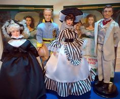 a group of dolls that are standing next to each other